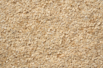 Many oat grains scattered on the table.