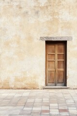 A weathered wooden door opens into a serene, empty courtyard, embraced by rustic beige walls, all bathed in the warm midday sun in a tranquil location