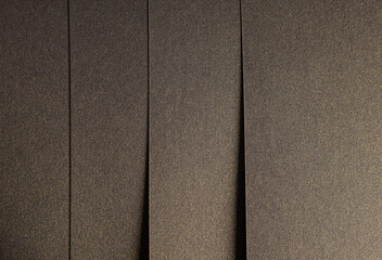 Brown designer paper texture with rich gold and bronze tones, glossy shimmering surface, geometric...