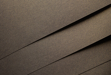 Brown paper texture with luxurious dark gold and antique gold tones, glistering glossy surface with geometric layered design, rich earthy contrast and shimmering finish for an elegant, sleek modern.