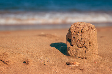 Sand castle at the seaside beach