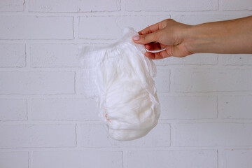 Diaper waste, dirty diapers. Disposal of used baby diapers