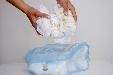Diaper waste, dirty diapers. Disposal of used baby diapers