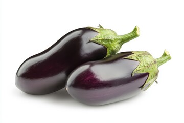 Two vibrant glossy eggplants plump and fresh against a bright white backdrop A close up showcasing their rich purple hue and green
