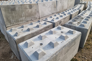 Rows of Textured Concrete Blocks in Storage
Interlocking Blocks for Construction