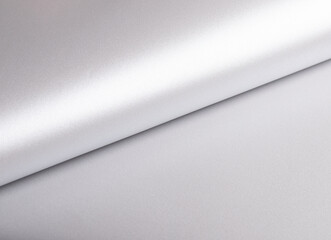 Silver paper texture with pearlescent gloss, sleek rolled design, and metallic platinum tones,...
