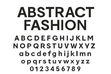 Display of bold typography emphasizing abstract fashion in black and white colors on a flat surface