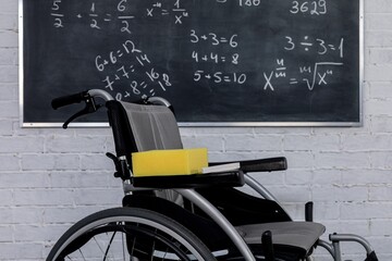An Empty Wheelchair is Positioned in a Classroom Surrounded by Various Mathematical Equations
