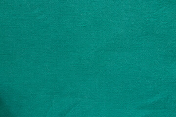 Green fabric background with texture, minimalist textile pattern, green