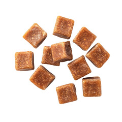 Natural brown sugar cubes scattered on a white background for culinary use and sweetening beverages