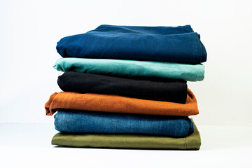 Multicolor casual pants stack for modern everyday fashion isolated on white