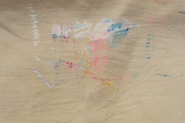 Grunge beige, brown, dirty canvas denim fabric with painting stain grain blot. Atr Texture abstract background.