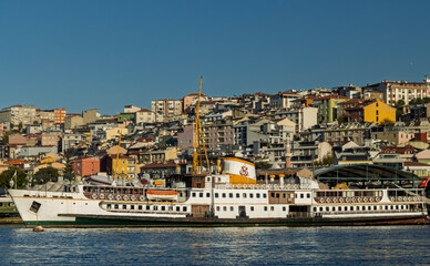 The elegant Fenerbahçe Vapuru, a historic passenger ferry painted in its signature white with green and black accents, the ferry features the classic design of Istanbul's iconic steamships.