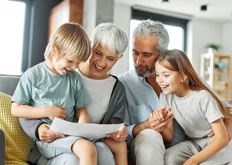 grandchild family child grandparent grandfather happy together grandmother girl senior boy read...