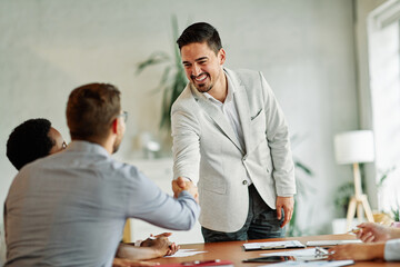 young business people meeting office handshake hand shake shaking hands teamwork  contract...