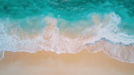 Stunning aerial view of turquoise ocean waves crashing on sandy beach sea blue foam calm water coast