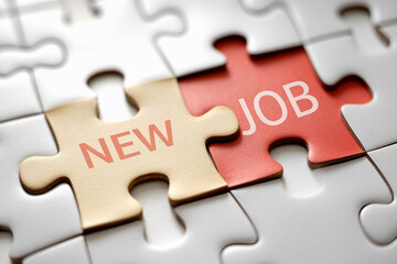 Obraz premium Close-up of two puzzle pieces, beige and red, with 