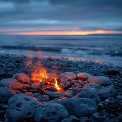A bonfire surrounded by smooth stones on a quiet beach, with an endless horizon and darkening sky.