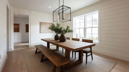 Modern dining room with a wooden table and six chairs. the table is rectangular in shape and has a wooden bench on the left side.
