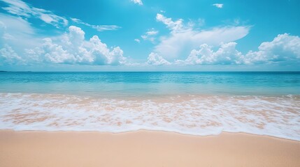 Fototapeta premium Serene tropical beach scene with azure ocean and fluffy white clouds summer vacation paradise sea sky