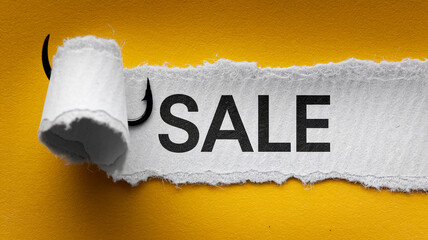 Torn paper reveals "SALE" on yellow background, a fishing hook suggesting a tempting offer, symbolizing a great deal or bargain