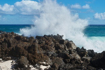 Caleta del Mojon Blanco beach on Atlantic Ocean with volcanic relief, big sharp rocks, big waves in Lanzarote, Spain