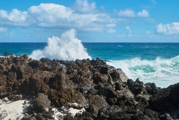 Caleta del Mojon Blanco beach on Atlantic Ocean with volcanic relief, big sharp rocks, big waves in Lanzarote, Spain