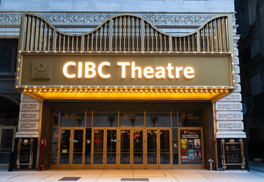 Chicago, Illinois, USA - October 22, 2024: Empty street of Chicago. CIBC Theatre. Performing arts CIBC theatre light sign entrance at downtown. View of the CIBC Theatre in Chicago