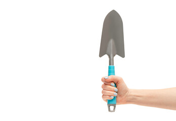 Female hand holding garden shovel, isolated on white