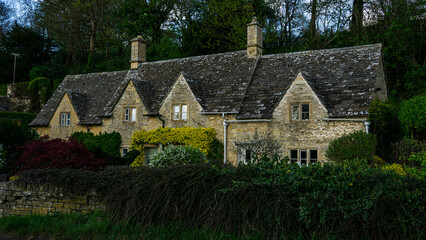 Charming historic stone cottage in Bibury, Cotswolds – a quintessential English village scene...