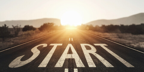 Asphalt road stretching towards sunset, "START" written on surface, symbolizing new beginnings, journey, and progress