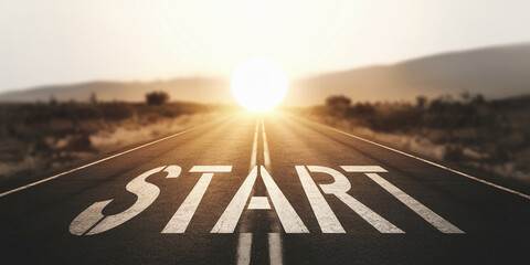 Asphalt road stretching towards bright sun, "START" painted on surface, symbolizing new beginnings, journey, ambition, and success