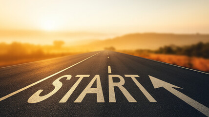 Asphalt road stretching to a sunrise, featuring the word "START" and an arrow, symbolizing new beginnings, journey, and progress