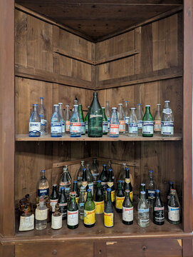 Old bottles of Borines mineral water at Borines mineral spring and bottling plant (built in 1892), Pilo a municipality, Asturias, Spain