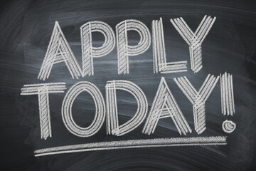 Chalkboard with the words "Apply Today!" written in bold, layered strokes of white chalk, creating a textured and attention-grabbing effect, showcasing urgency and opportunity