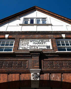 LONDON, UK - APRIL 06, 2025:  Front facade and sign on the outside of Spitalfields Market in Shoreditch