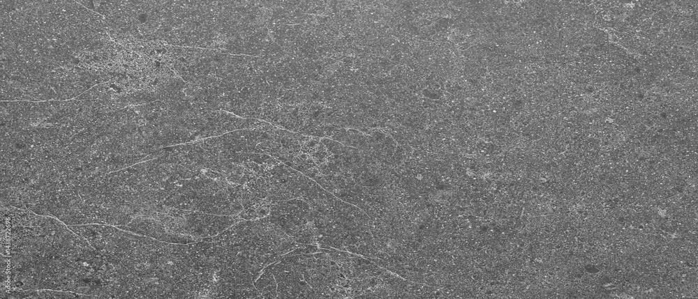 Poster Gray wall with many cracks holes scratches and marks. wall is made of concrete and has a rough texture as an abstract texture background for template pages and banners