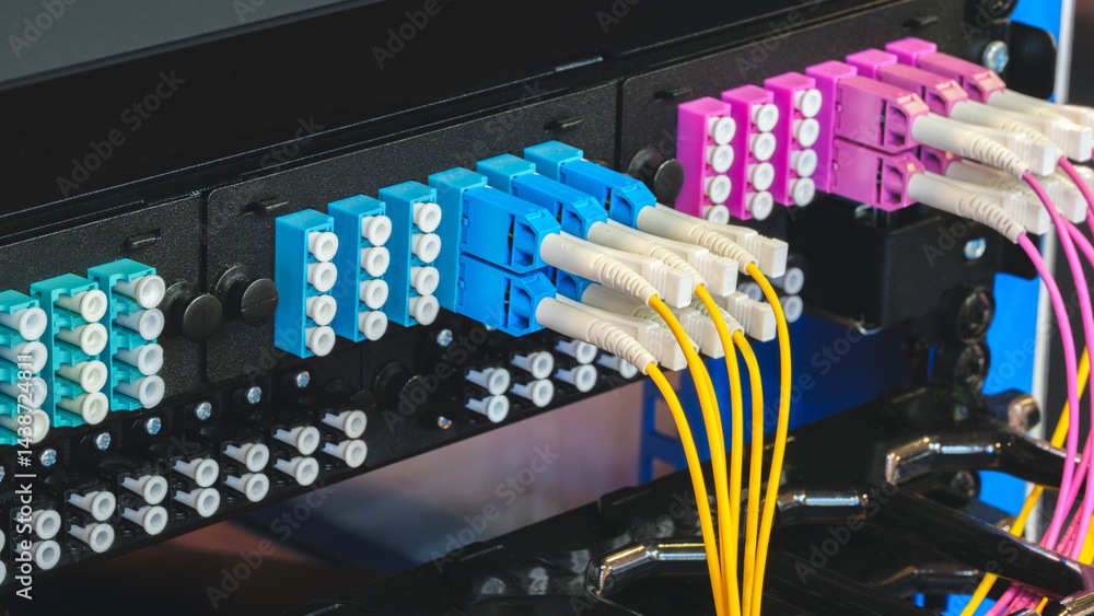 Poster A row of cables with different colors and numbers. The cables are connected to a black box. Internet and communications concept background