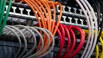 A row of cables with different colors and numbers. The cables are connected to a black box....