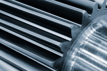 A close up of a gear with a lot of detail. The gear is made of metal and has a shiny, reflective...