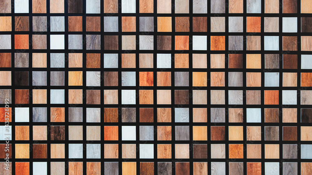 Poster abstract multi-colored background of wooden squares of different colors arranged in several even horizontal rows of mosaic. wall is made of wood and has a brown and white color scheme.