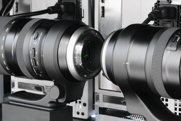 A green laser passes through optical instruments in a physical optical science laboratory