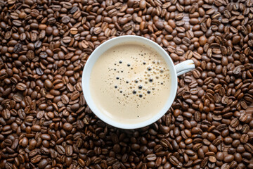 coffee beans in a vintage white cup