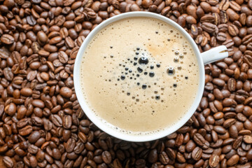 coffee beans in a vintage white cup