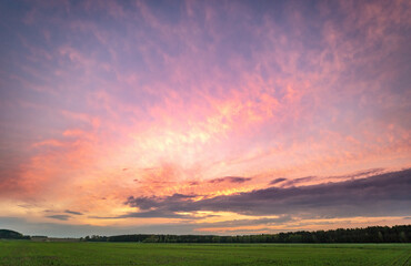 Beautiful sky background with clouds after sunset. Red yellow sky.