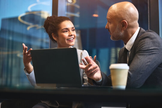 Business people, colleagues and laptop in office for collaboration, brainstorming or proposal in career. Team, mentorship and partnership with coworkers, peer review or feedback as employees at work