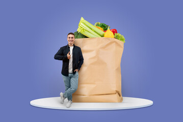 A cheerful customer stands beside a large paper grocery bag filled with fresh vegetables and...