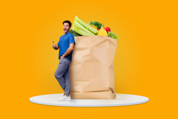 A satisfied customer stands next to a large paper bag filled with fresh groceries, showcasing...