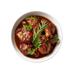 Fototapeta premium A bowl of succulent chicken pieces cooked in a rich, savory sauce, garnished with fresh herbs.