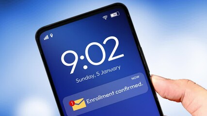 Enrollment confirmation message and email concept on the smartphone screen, 4k footage with blur backdrop. College, education, notification